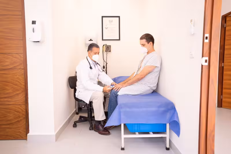 Doctor and patient consultation for Why a Calm Arrival Helps Before Microsuction - Best Method To Make Your Way To Surbiton...